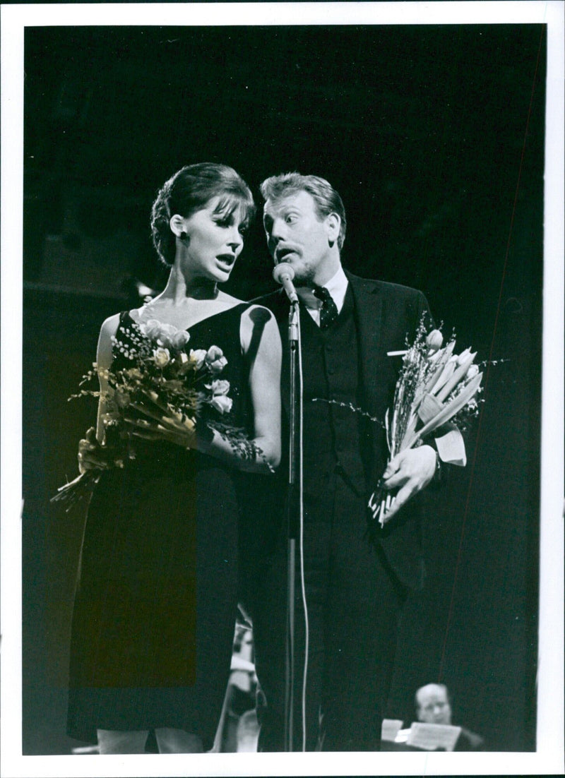 Svante Thuresson and Lil Lindfors pose with their trophy after winning the Swedish selection for the 1966 Eurovision Song Contest. - Vintage Photograph