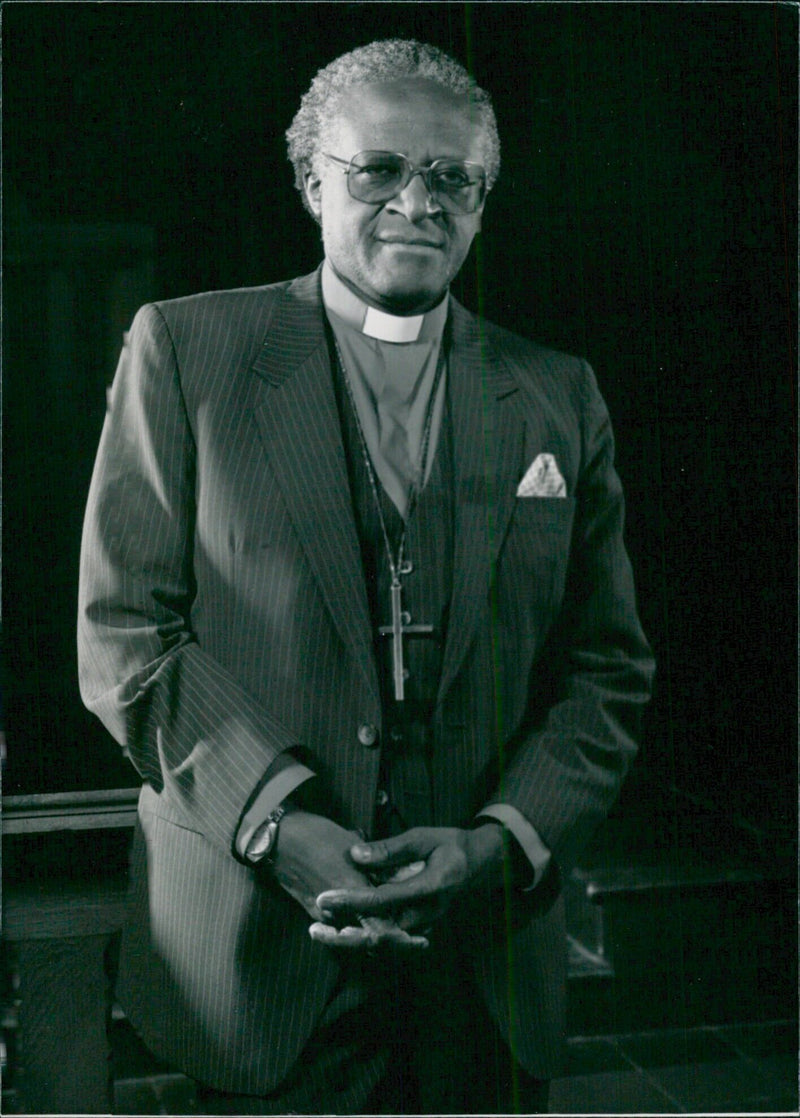 Bishop Desmond Tutu, winner of the 1984 Nobel Peace Prize, speaks at a South African Church gathering in 1985. - Vintage Photograph