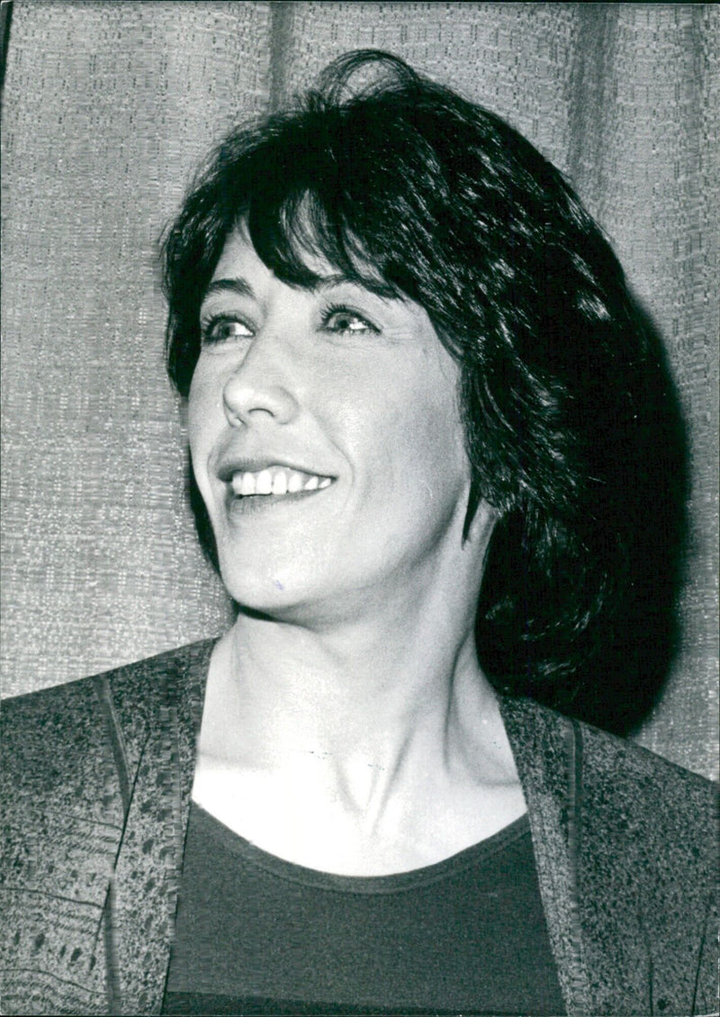 American comedienne and comedy actress Lily Tomlin poses for a portrait in 1976. - Vintage Photograph