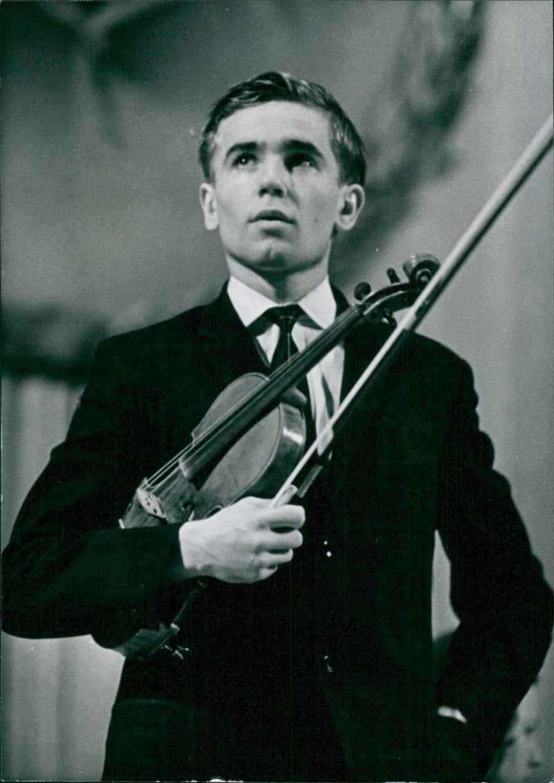 Victor Tretyakov, the young violinist and winner of the 1968 International Tchaikovsky Music Competition, performs in Stockholm, Sweden on September 21, 1968. - Vintage Photograph