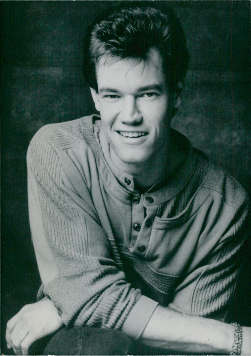 Country music star Randy Travis poses with his awards for Best Country Album and Best Single at the 1987 Annual American Music Awards. - Vintage Photograph