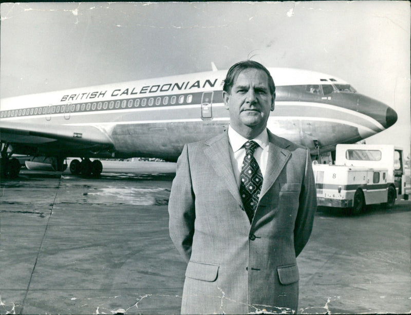 Adam Thomson, Chairman and Chief Executive of British Caledonian Airways, poses for the Financial Times Camera Press in London in 1974. - Vintage Photograph