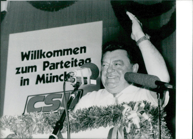 West German politician Franz Josef Strauss is re-elected as leader of the Christian Social Union (CSU) at a party rally in Munich, Germany in July 1983. - Vintage Photograph