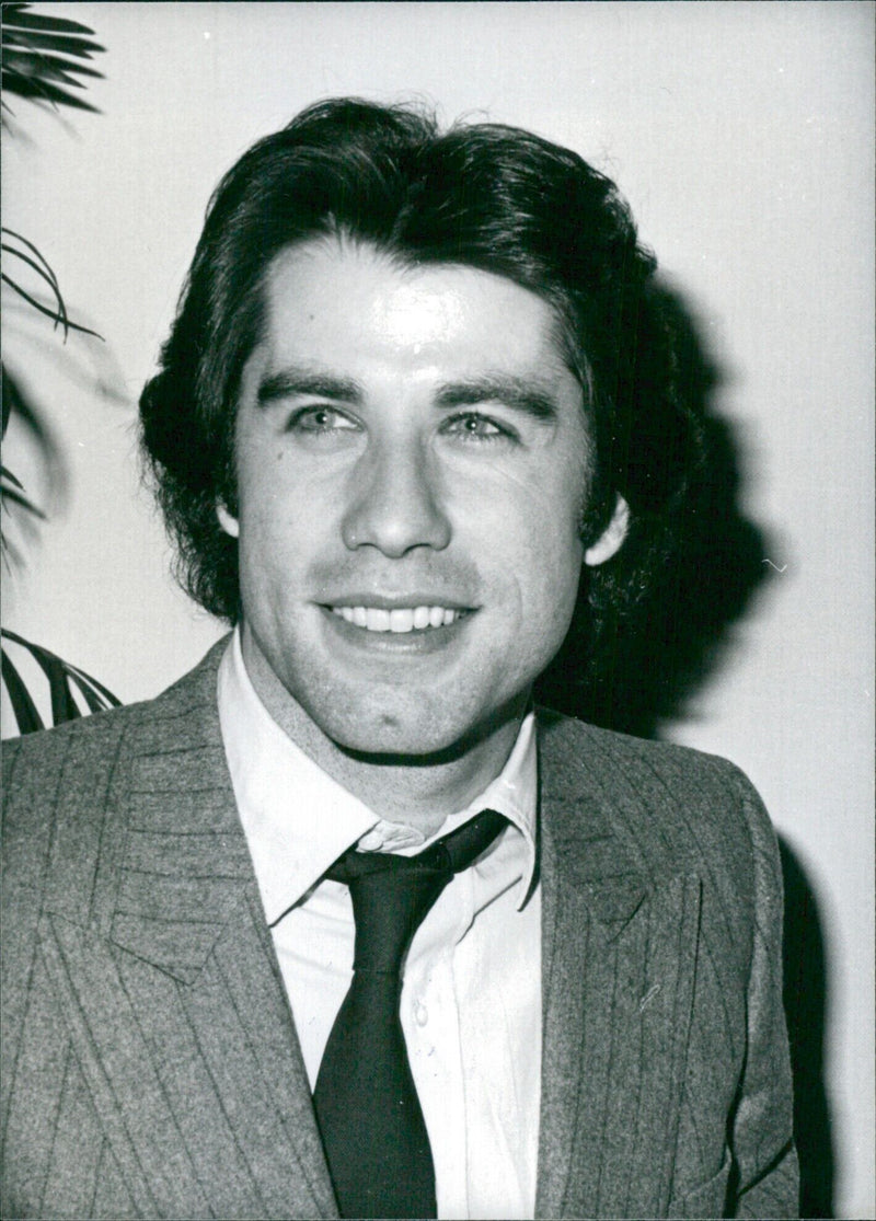 Actor John Travolta poses for the camera following his resurgence of popularity due to his latest film, "Urban Couboy". - Vintage Photograph