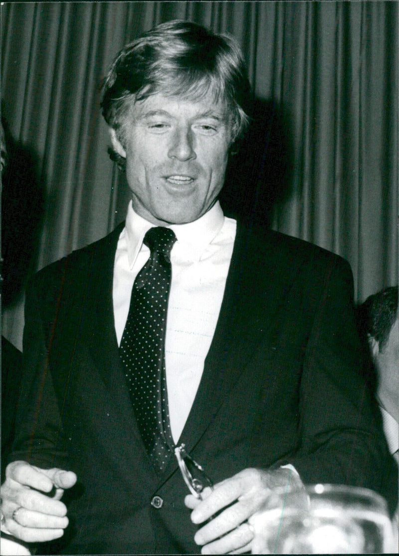 Actor Robert Redford makes a rare public speaking appearance in Hollywood, addressing members of the Hollywood Radio and TV Society at a Beverly Hilton Hotel luncheon. - Vintage Photograph