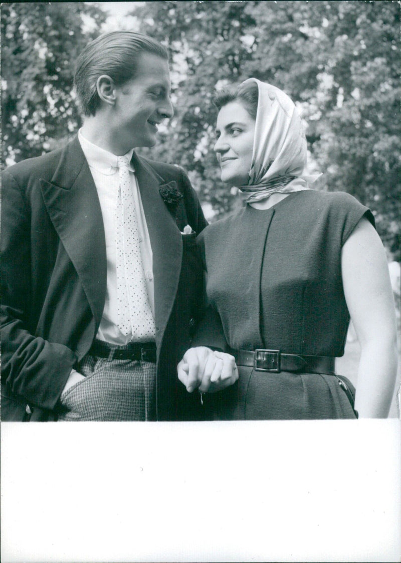 Daphne Fairbanks, the eldest daughter of American actor-producer Douglas Fairbanks, Jr., announces her engagement to David Weston in the garden of the Fairbanks' London house. - Vintage Photograph