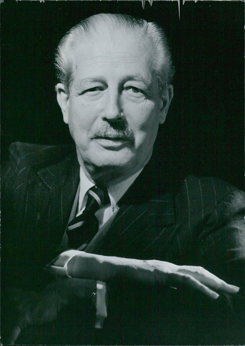 British Prime Minister Harold Macmillan poses for the camera during a visit to Stockholm, Sweden in 1960. - Vintage Photograph