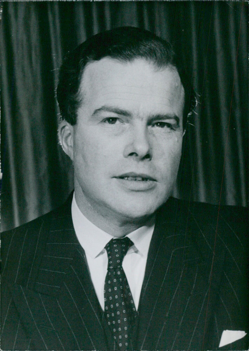 British Politician James David Gibson-Watt M.C., M.P., a Lord Commissioner of the Treasury, poses for a photo on October 1959. - Vintage Photograph