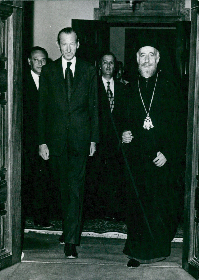 Archbishop Makarios, Prime Minister of Cyprus, meets with United Nations Secretary-General Dr. Kurt Waldheim during a visit to Cyprus in August 1973. - Vintage Photograph