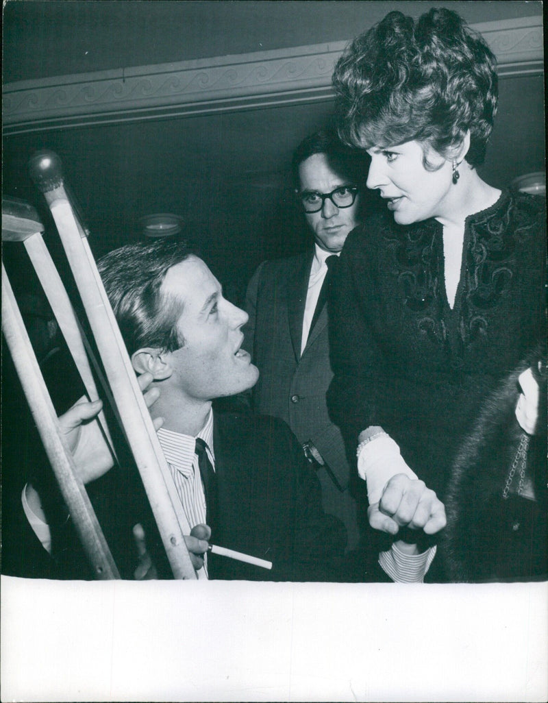 Peter Forda and Polly Pergen of the International Magazine Service in Stockholm, Sweden, enjoy a conversation in a café in New York City on 21st October 1964. - Vintage Photograph