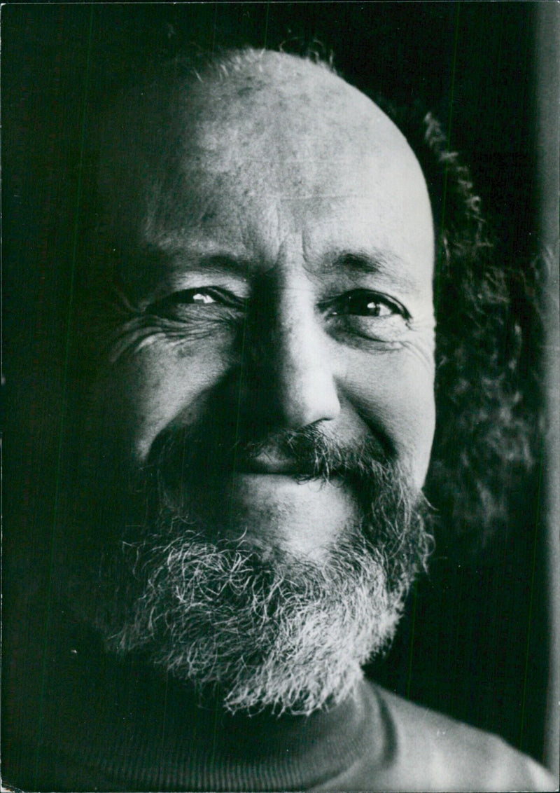 French sociologist and writer Louis-Vincent Thomas poses with his new book, "Anthropologie de la Mort," in Paris. Photo: Julien Quideau / Camera Press / L'Express - Vintage Photograph