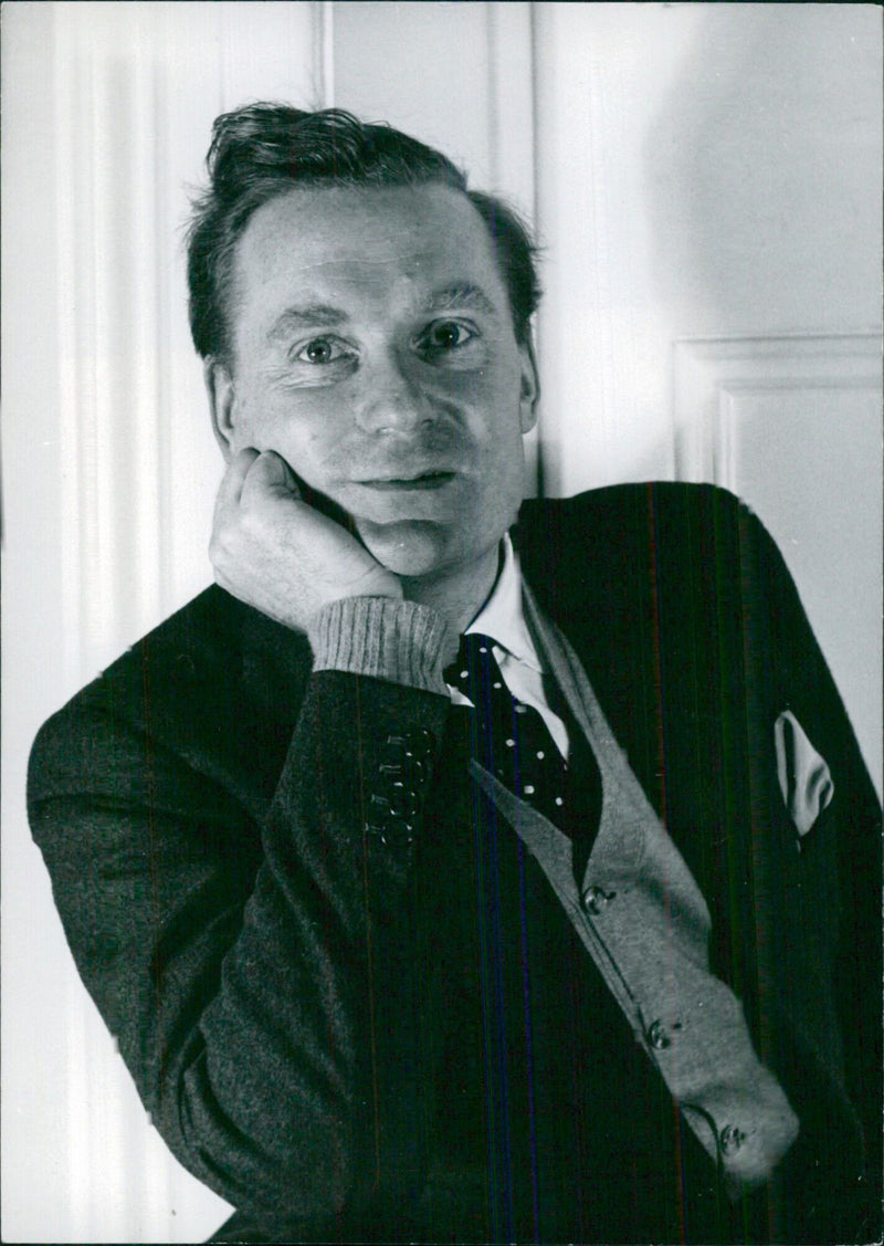 Peter Daubeny, British impresario, poses on the London stage with plays, ballets, and folk dances of many lands. - Vintage Photograph