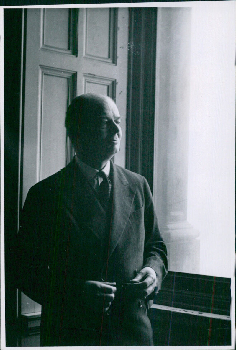 Haberly Esler, the Assistant Under Secretary of State, is seen here visiting the Far Eastern Department of the Foreign Office in London. - Vintage Photograph