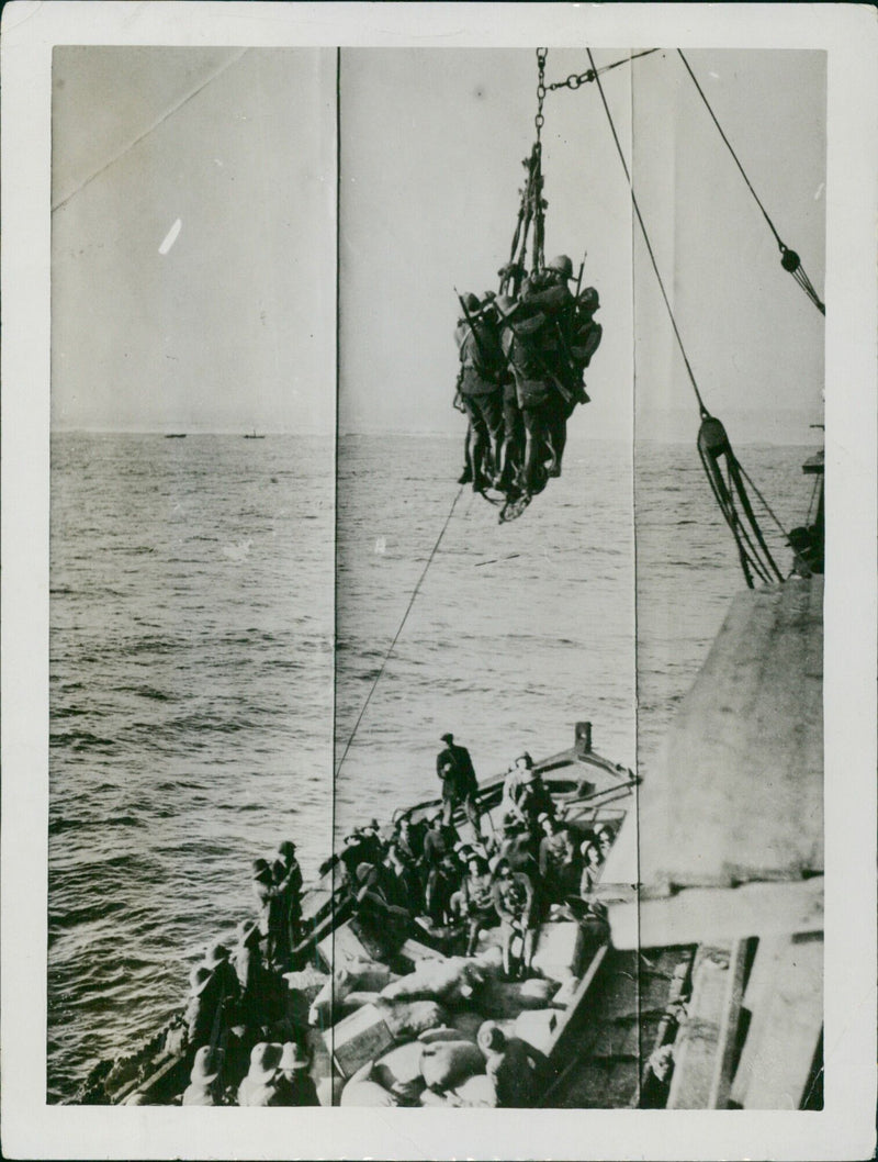 British troops disembarking in France during World War I, as seen in a photograph taken by the Daily Mirror in 1915. - Vintage Photograph