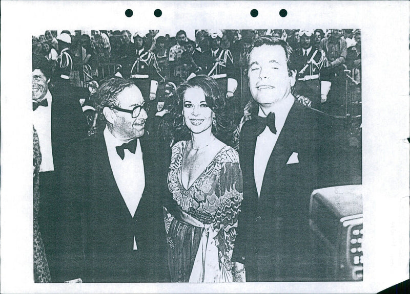 Robert Wagner and Natalie Wood pose for a photo during a public event. - Vintage Photograph