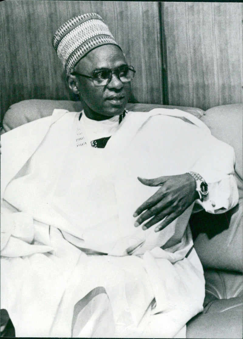 President Shehu Usman Aliyu Shagari of Nigeria poses for a portrait in 1987. - Vintage Photograph