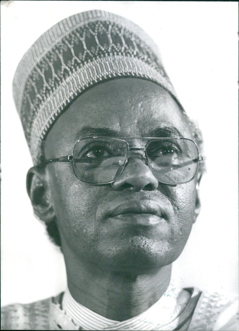 Nigerian President Alhaji Shehu Usman Aliyu Shagari poses for a photograph in 1987. - Vintage Photograph