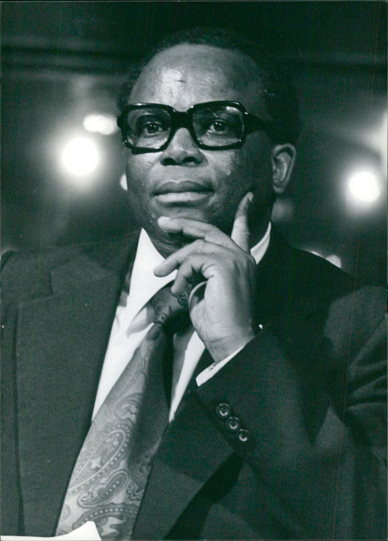 David Thebehali, Chairman of the Soweto Council, speaks to a group of Black South African politicians in Soweto, South Africa. - Vintage Photograph