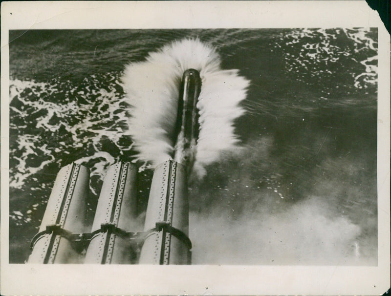 US Navy Destroyer Flotilla takes part in Torpedo Practice, firing dummy torpedoes at battleships of the fleet. - Vintage Photograph