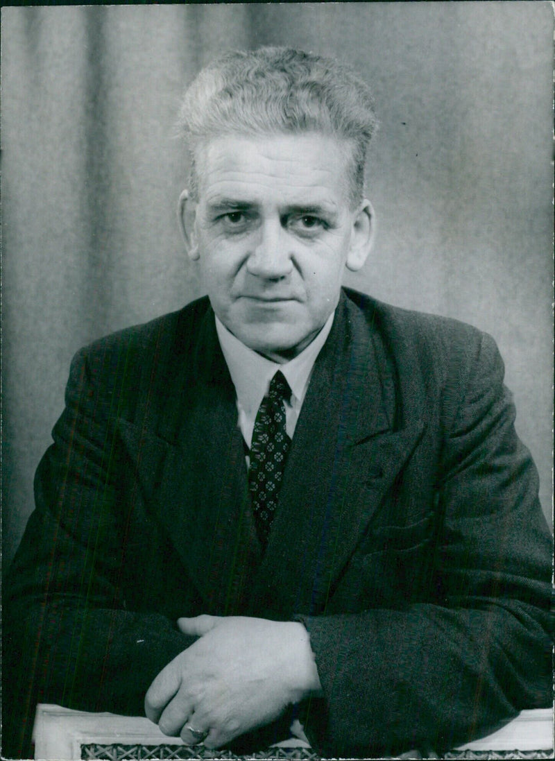 On July 25th, British Trades Union Leaders Hugh Kelly, General Secretary of the Plumbing Trade Union, is seen in a portrait study by photographer Tom Blau. - Vintage Photograph