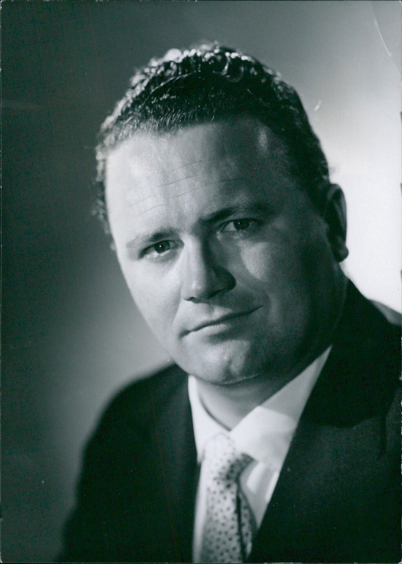 British radio and television comedian, Harry Secombe, poses for a portrait study by Count Zichy. - Vintage Photograph