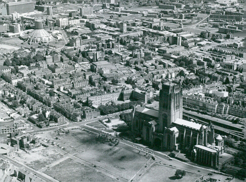 Liverpool's two cathedrals, the Anglican Cathedral and the Roman Catholic Metropolitan Cathedral, are seen in this view of the city. - Vintage Photograph