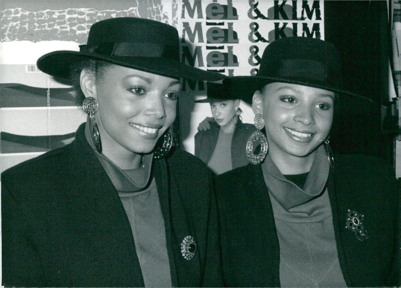 British pop duo Mel and Kim pose for a photo in 1986. The two girls from London's East End found chart success with their single "Showing Out". - Vintage Photograph