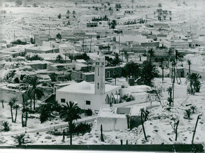 Residents of Jado, Libya enjoy the view of the Djebel Nef- usa from the county capital. - Vintage Photograph