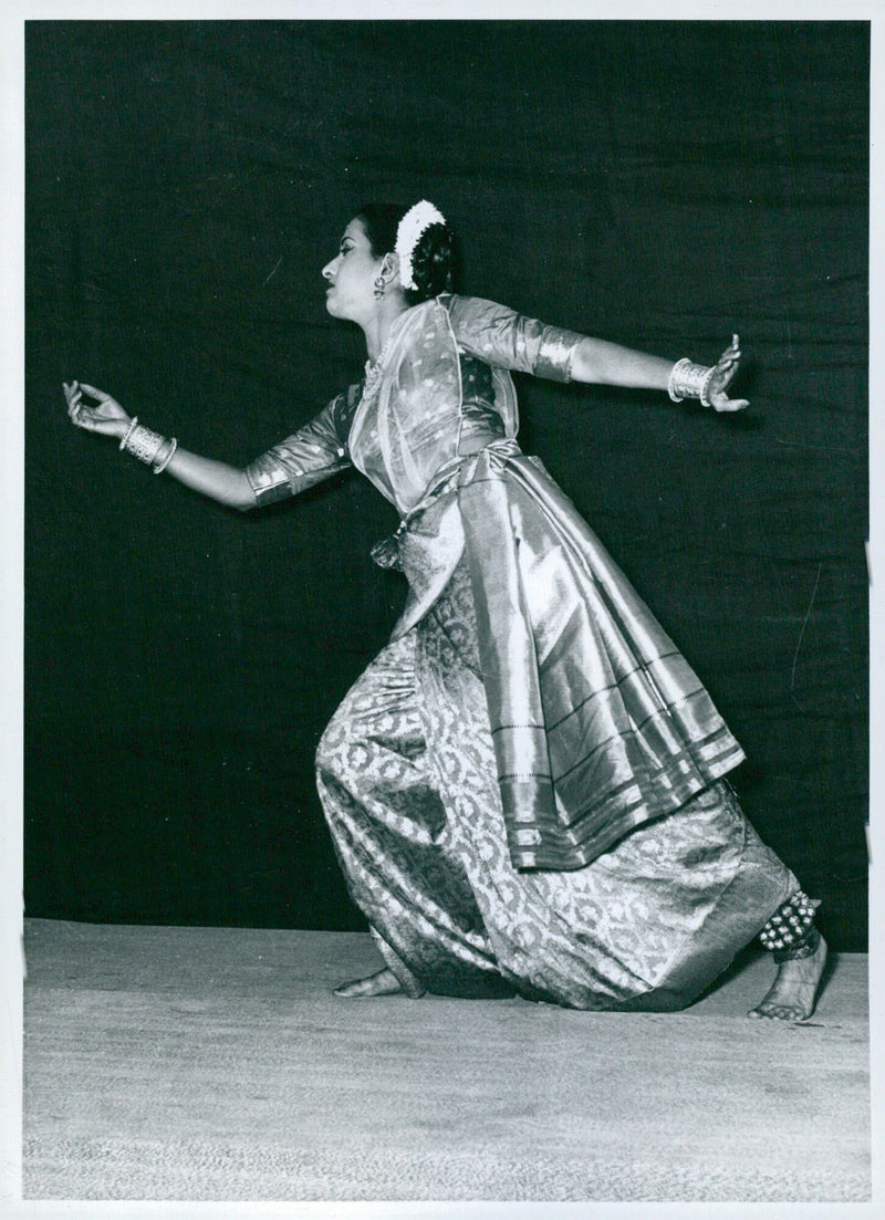 Performing Indian classical dance, an actress conveys the emotion of love and regret in the "Kalahantarita" scene. - Vintage Photograph