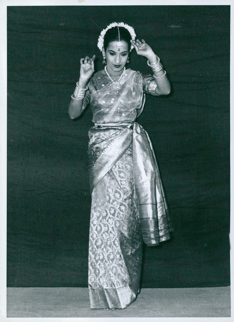 A classical Indian dancer conveying emotions of love and distress during a Virahot Kanthita performance. - Vintage Photograph