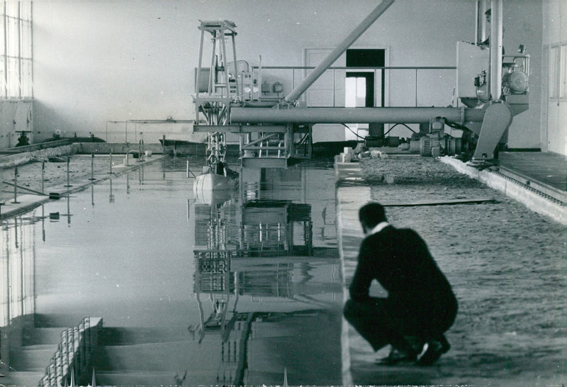 Scientists at the Suez Canal Authority conduct tests to measure wave damage to the canal banks and assess the new sections of the canal. - Vintage Photograph