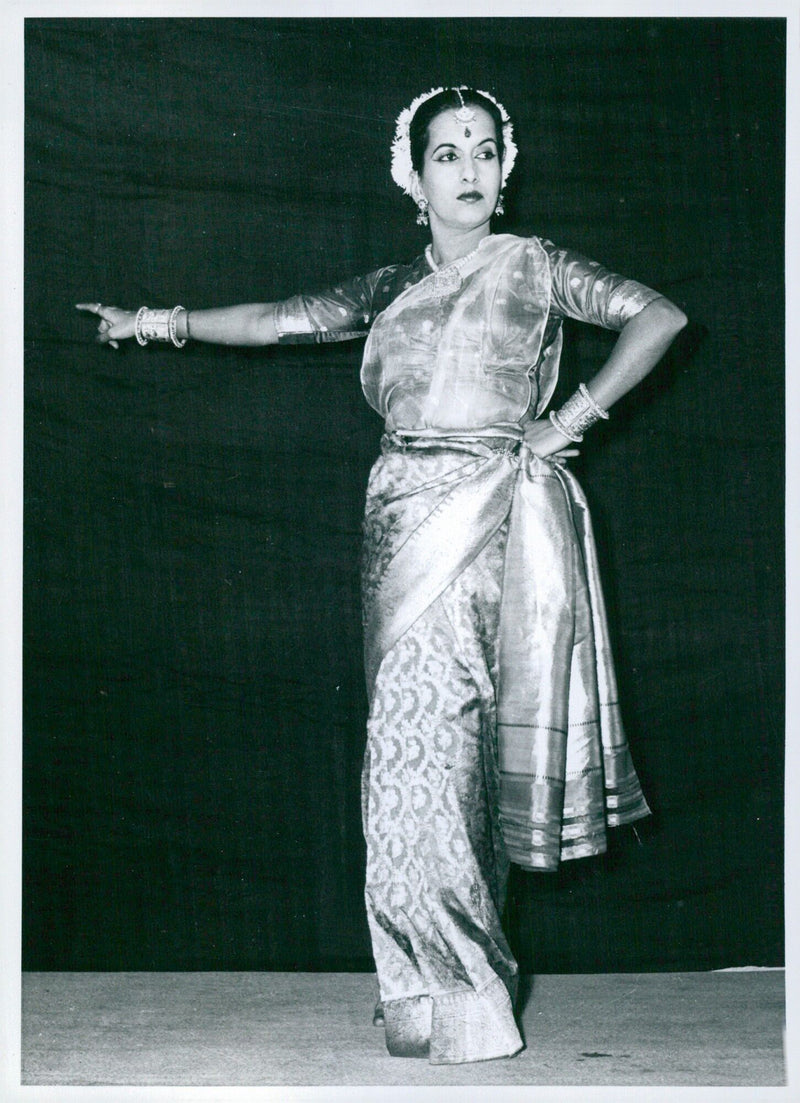 A dancer performing Indian classical dance conveys the emotions of love, jealousy and pique as she discovers her lover's infidelity. - Vintage Photograph