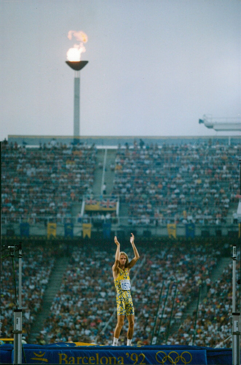 Barcelona '92 Olympic high jumper Patrick Sjöberg celebrates his silver medal win on August 2, 1992. - Vintage Photograph