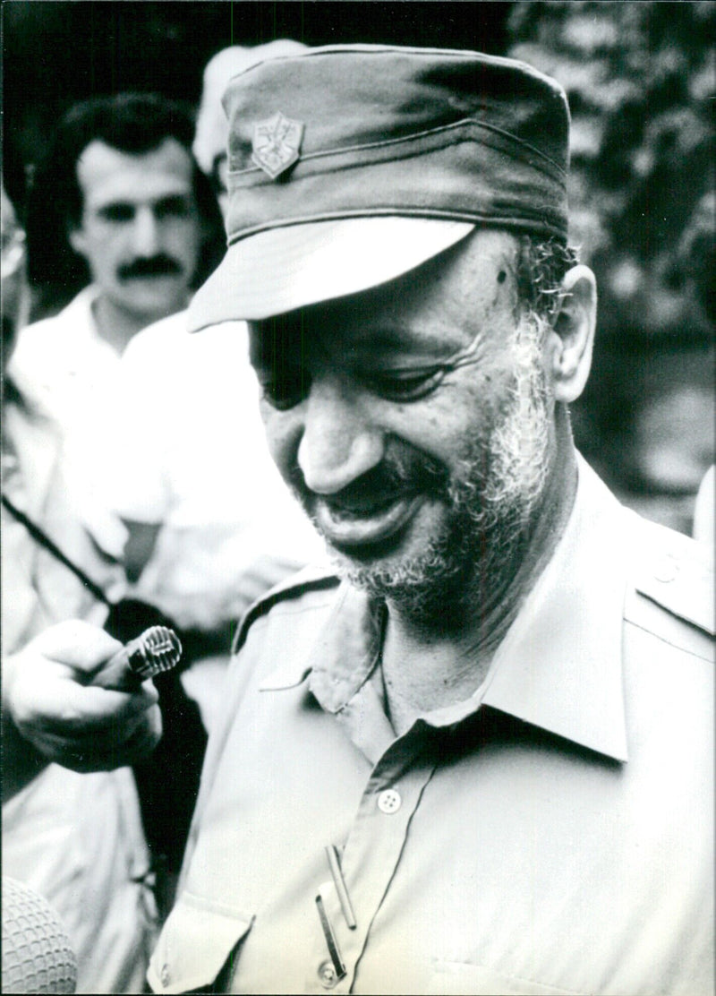 Palestinian leader Yasser Arafat, Chairman of the Palestine Liberation Organisation, is photographed in 1982. - Vintage Photograph