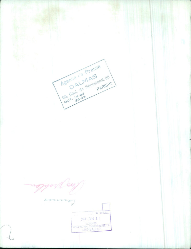 A group of people gather near the Cannes Film Festival in 1962. - Vintage Photograph