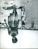 A group of people gather near the Cannes Film Festival in 1962. - Vintage Photograph