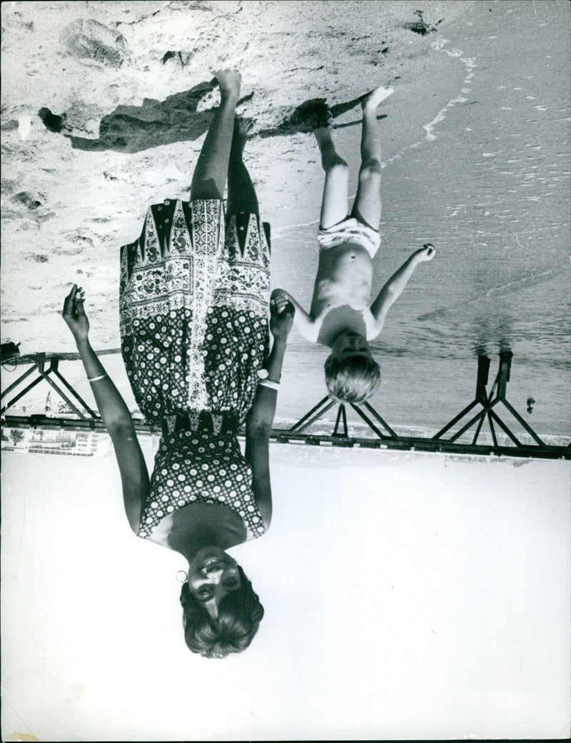 A group of people gather near the Cannes Film Festival in 1962. - Vintage Photograph