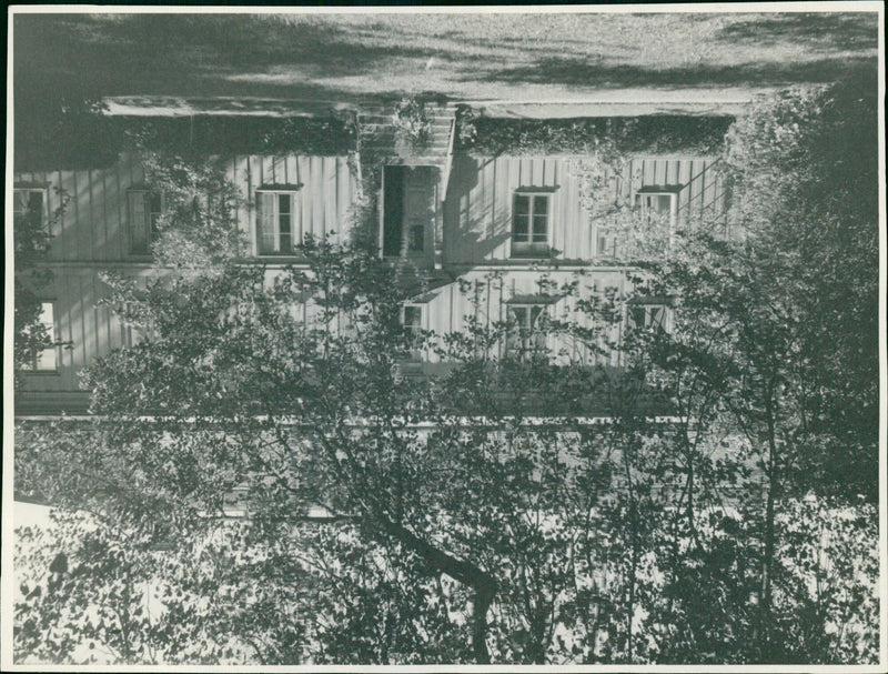 Two men in traditional Vanueland costumes pose with a Diskopsparden N 39 Karlasad 1907 rifle in the 2.9. Velend area of Karlasad. - Vintage Photograph
