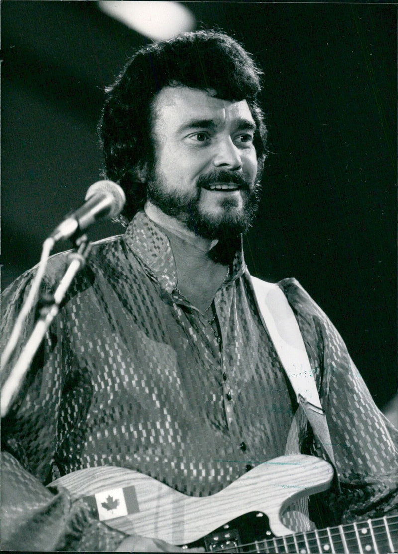 Canadian country and western singer Ronnie Prophet performs at the Wembley Country Music Festival. - Vintage Photograph