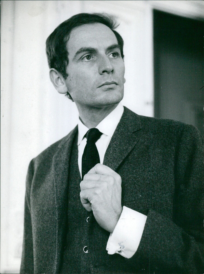 A model poses in a Pierre Cardin ensemble in 1965. - Vintage Photograph