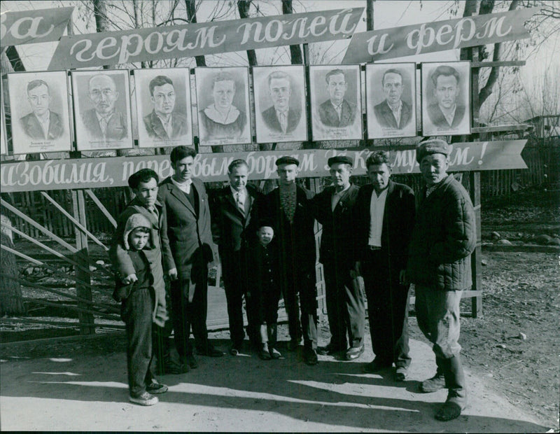 A group of people gathered in Torsgåt, Sweden, to celebrate the heroes of Polessk 3R0900007 on December 2, 1965. - Vintage Photograph