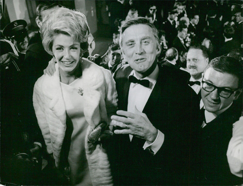 Kirk Douglas and Anne Buydoux attend the 1953 Cannes Film Festival. - Vintage Photograph