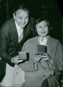 Maj-Britt Nilsson is presented with the Swedish Film Fund's award by Reciat Andersson and Erik Stragete at the opening of the Swedish Film Festival in Stockholm, Sweden, on May 1, 1956. - Vintage Photograph