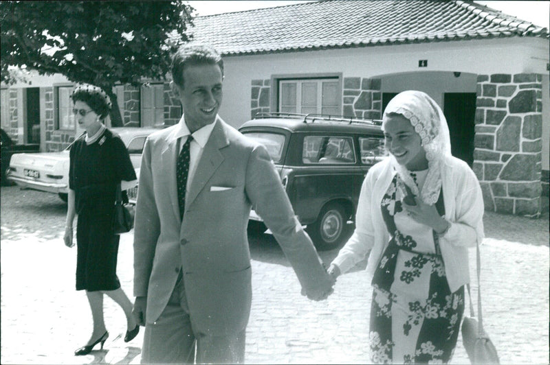 Swedish Prime Minister Tage Erlander greets the crowd during a visit to Frochot Avenue in Stockholm on July 20, 1964. - Vintage Photograph