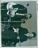 Mr. Tony Danning stands with his brother at a poetry event. - Vintage Photograph