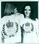 A model wearing the official Silver Jubilee emblem on a t-shirt and bomber jacket. - Vintage Photograph