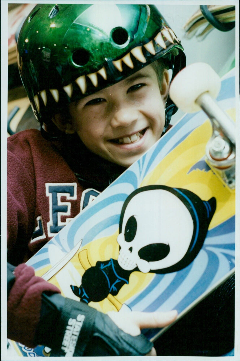 Nine-year-old Alex Grinsted receives a prize sponsored by Legends store. - Vintage Photograph