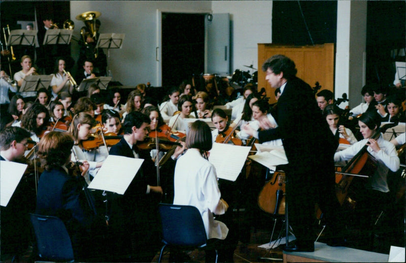 Richard Hallam conducts the Central Music School Symphony Orchestra at the Oxford Youth Prom. - Vintage Photograph