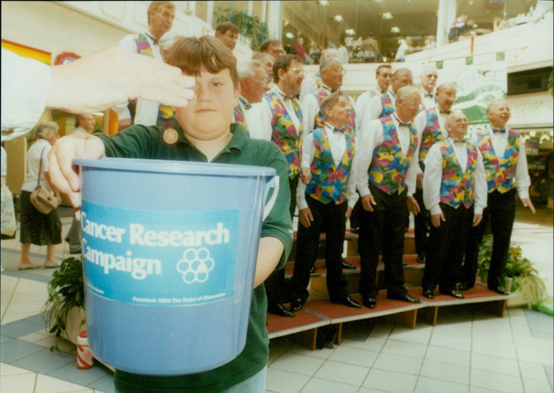 Members of the White Horse Harmony Barbershop Singers from Wantage performing at the Westgate Centre in aid of cancer research. - Vintage Photograph