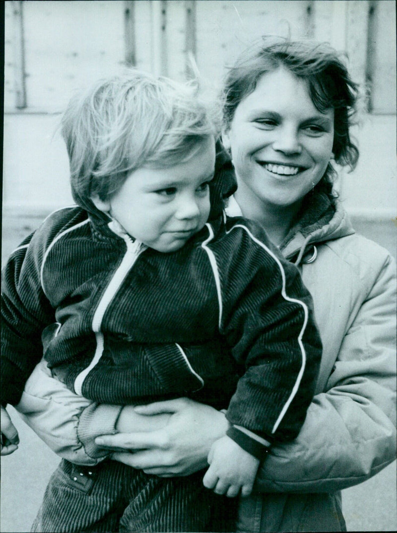 Mrs. Dawn Curley and her two-and-a-half-year-old son David rely on bus fare and emergency payments to feed and clothe them. - Vintage Photograph